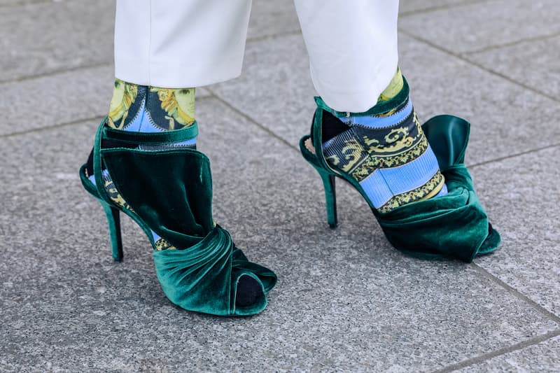 paris couture week spring summer street style adut akech bottega veneta nike air jordan 1 mid melody ehsani collaboration snakers designer bags blazer jeans pants coats outwear shades sunglasses