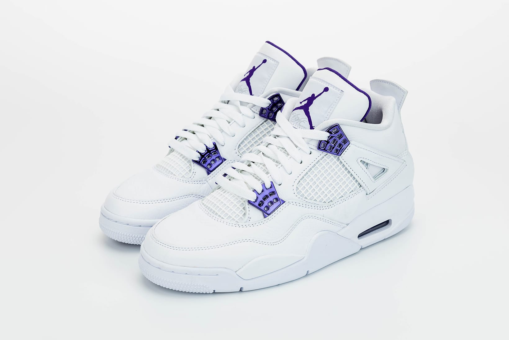white purple jordan 4s