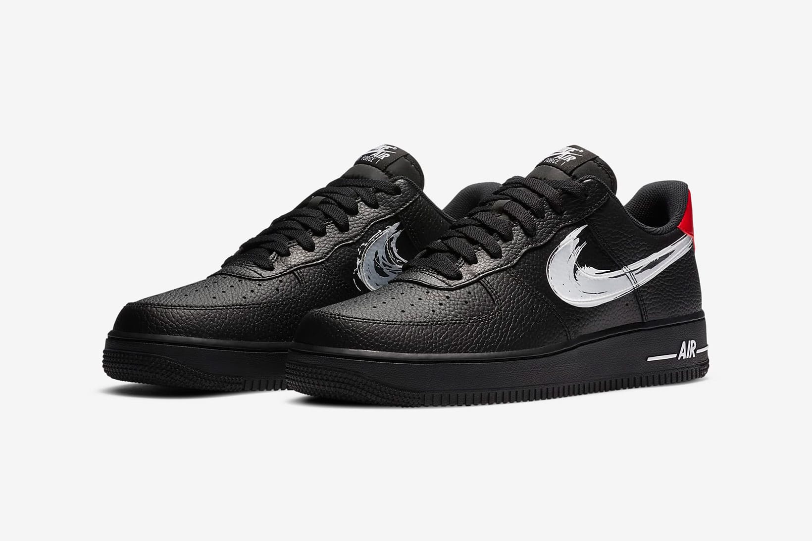 black air forces with white nike sign