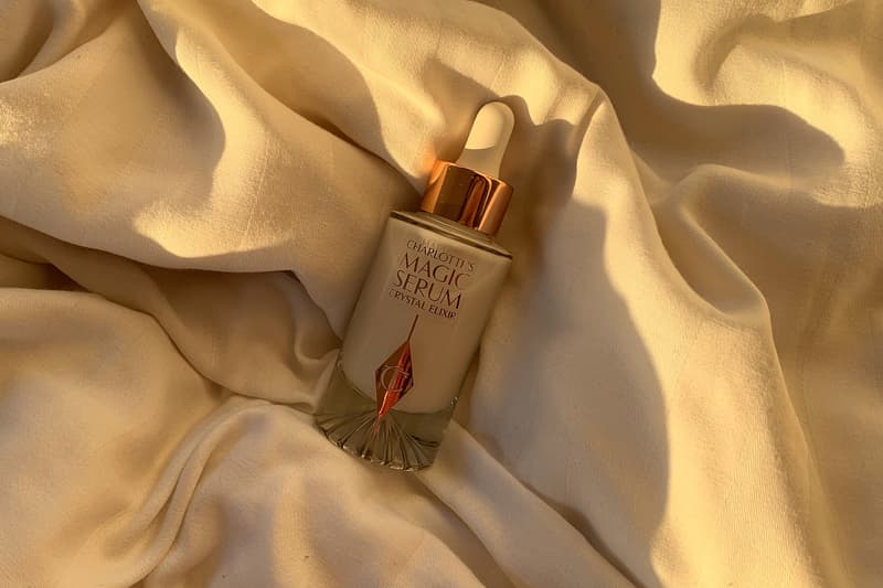 charlotte tilbury magic serum crystal elixir skincare product sunlight bedsheets