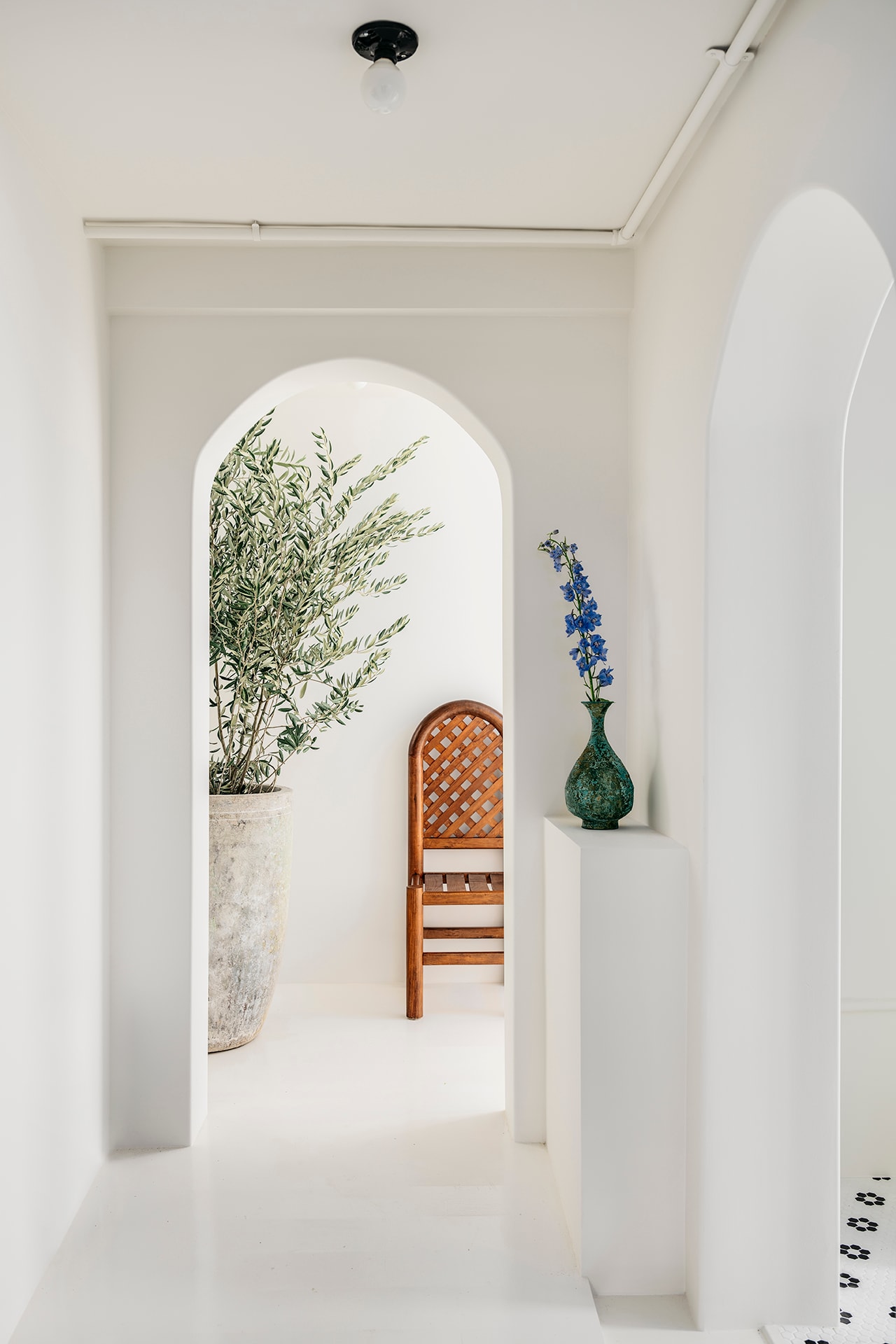 Monastery Organic Skincare Spa Facial San Francisco Beauty Athena Hewett Interior Design Table Flowers Vases Archway