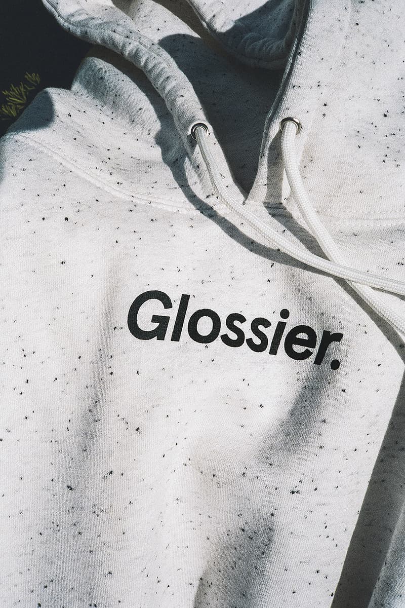 glossier glossiwear limited edition terrazzo hoodie gray sneaker white duffle bag