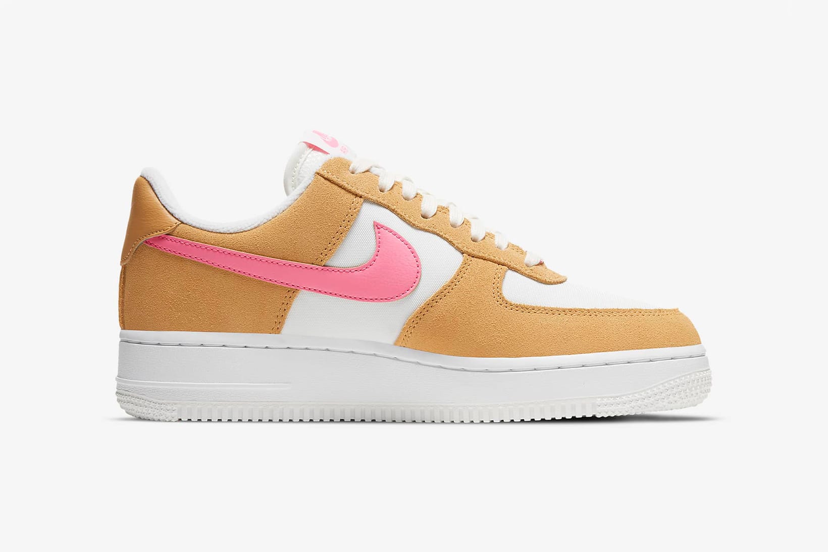 white nike shoes with pink and orange