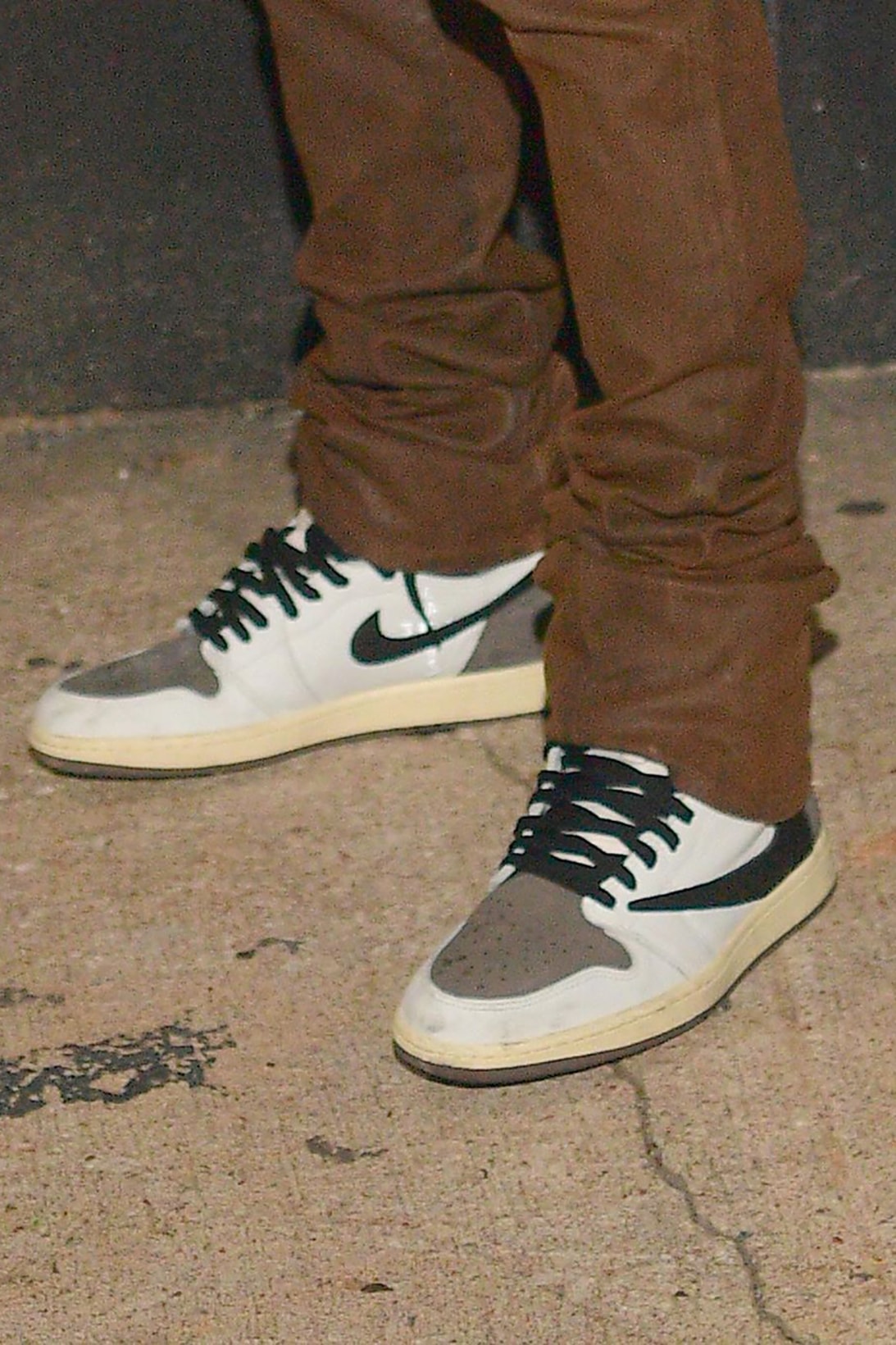 nike travis scott collaboration air jordan 1 high sneaekrs reverse white brown colorway on feet footwear sneakerhead shoes