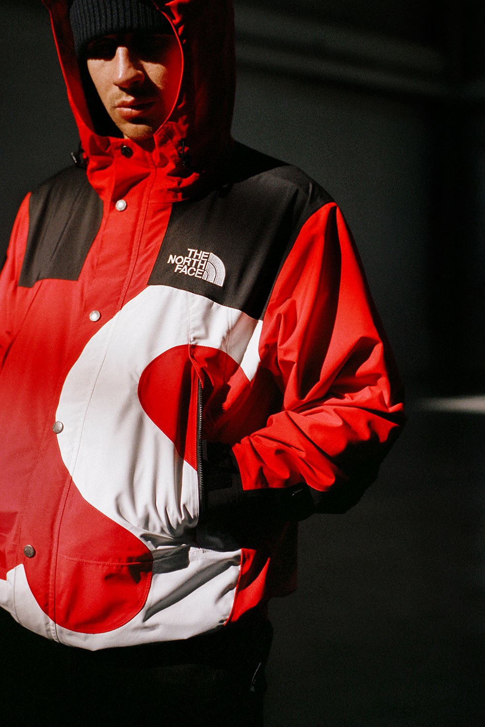 Fashion detail of Supreme red jacket, is seen in the streets of