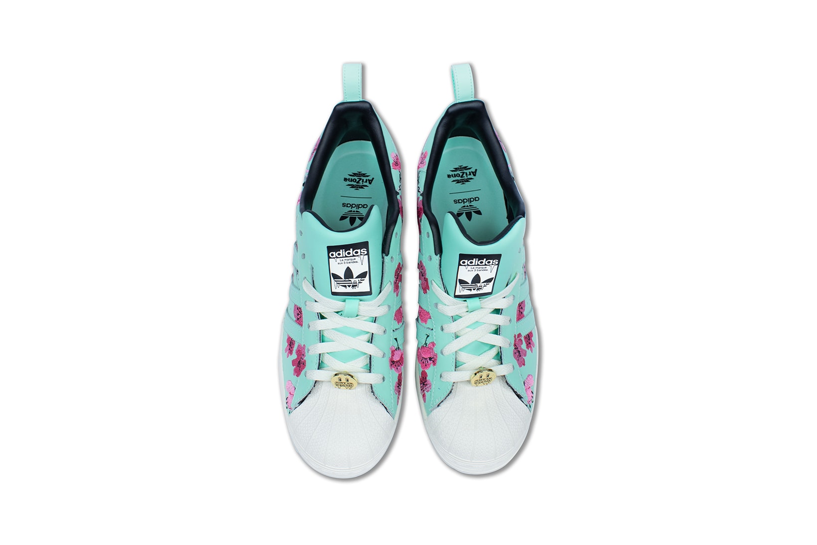 adidas originals arizona iced tea superstar collaboration sneakers big cans aerial birds eye view teal blue laces white gold pink flowers insole black