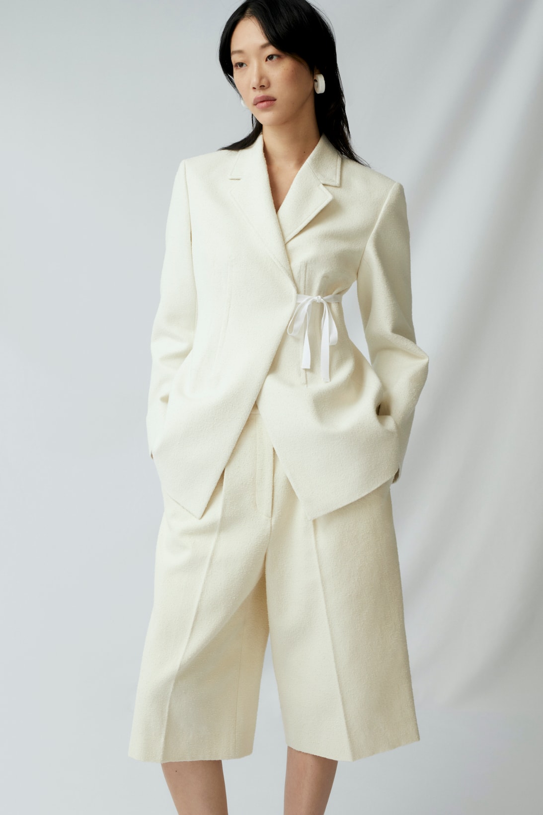 sora choi cos spring womenswear summer collection lookbook white jacket pants outerwear earrings jewelry