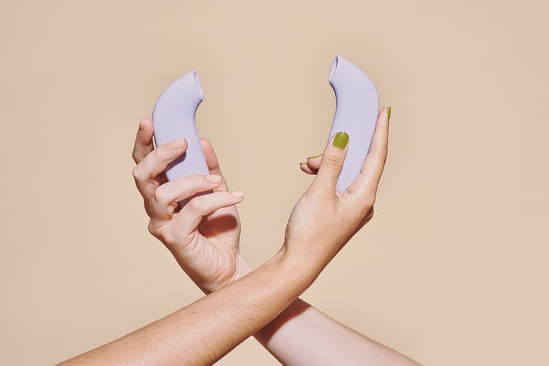 dame products aer sex toy clitoral stimulator pressure wave suction hand side view purple