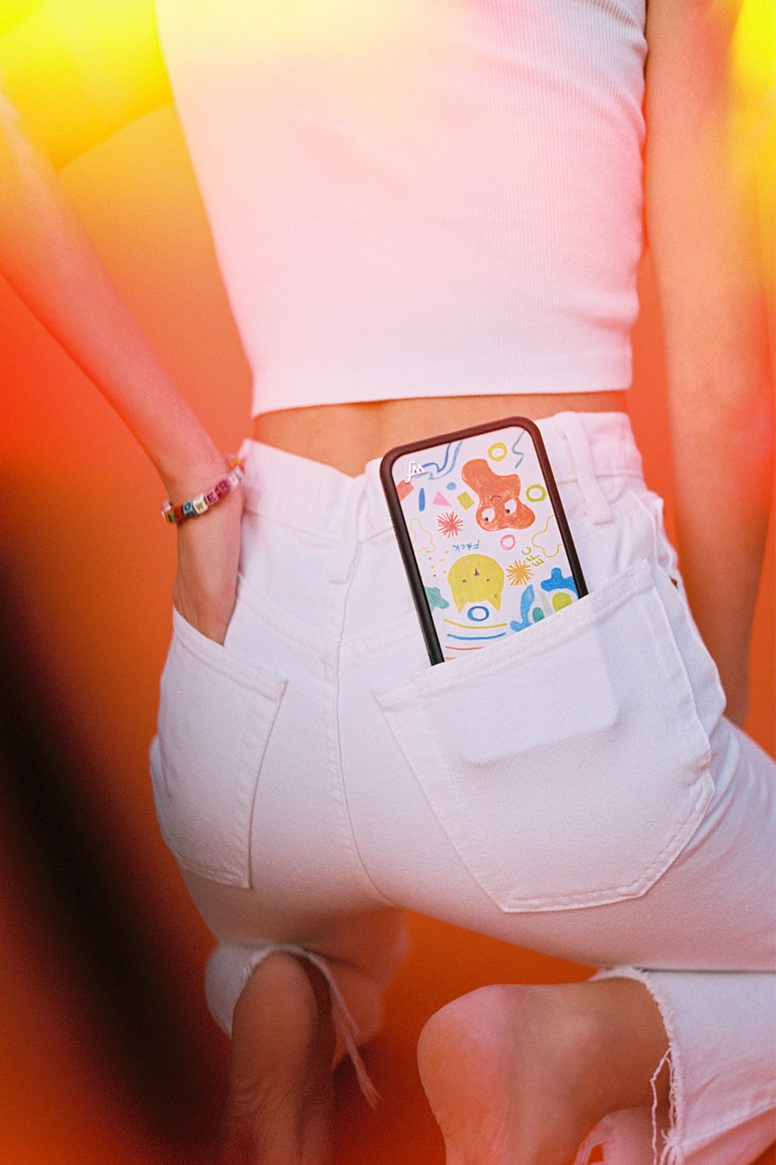 emma chamberlain wildflower iphone cases collaboration all-white jeans top