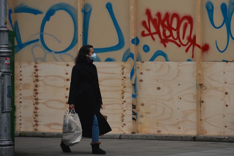 Woman Face Mask Closed Store Dublin Ireland Coronavirus COVID-19 Lockdown