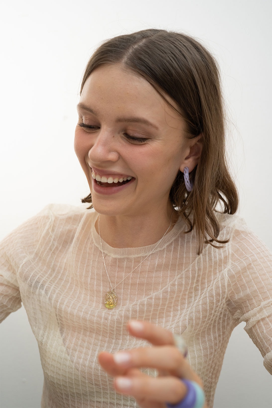 keane brooklyn glass jewelry brand earrings accessories hands sheer white top