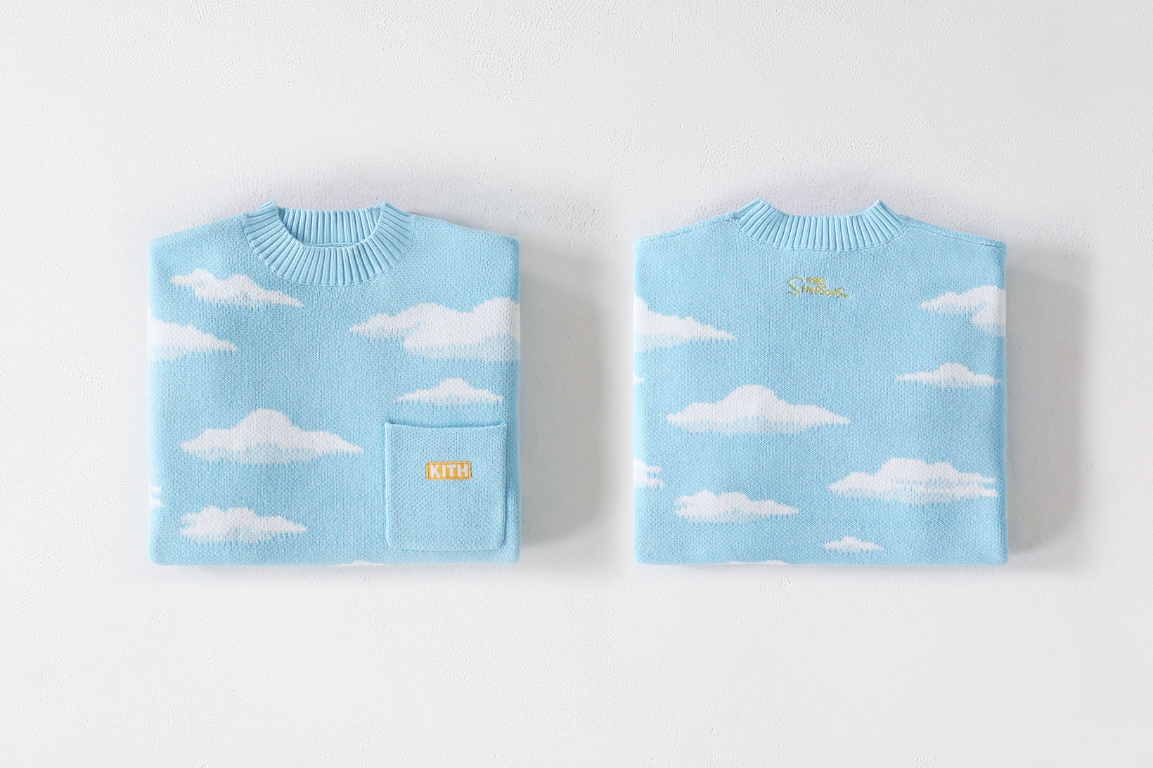 the simpsons kith collaboration knitwear sweater sky blue clouds logo