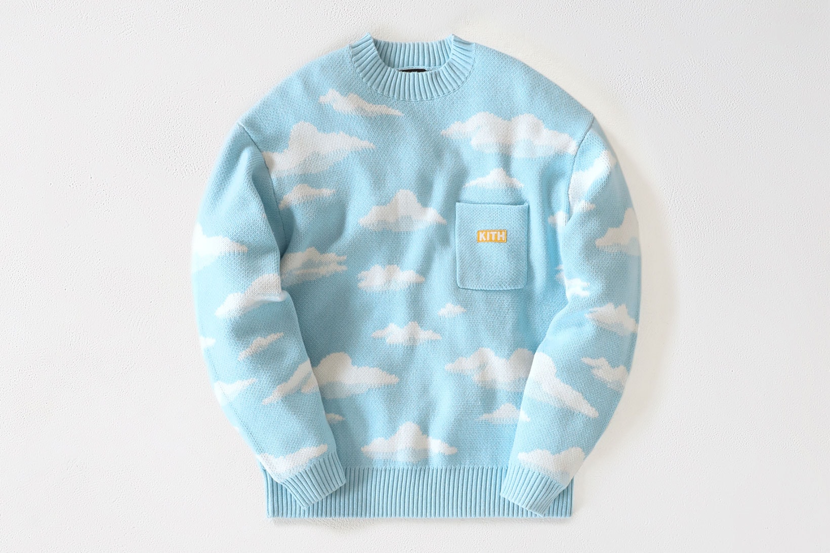 the simpsons kith collaboration knitwear sweater sky blue clouds logo