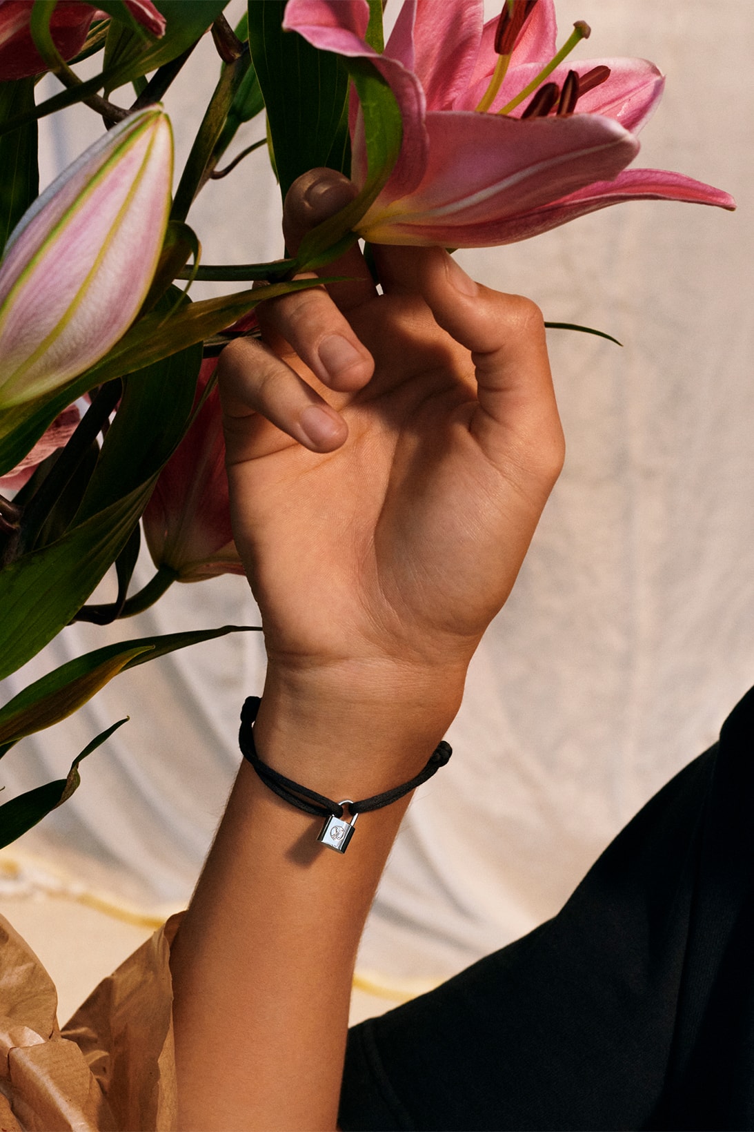 louis vuitton silver lockit bracelets unicef makeapromise campaign donation charity flowers black