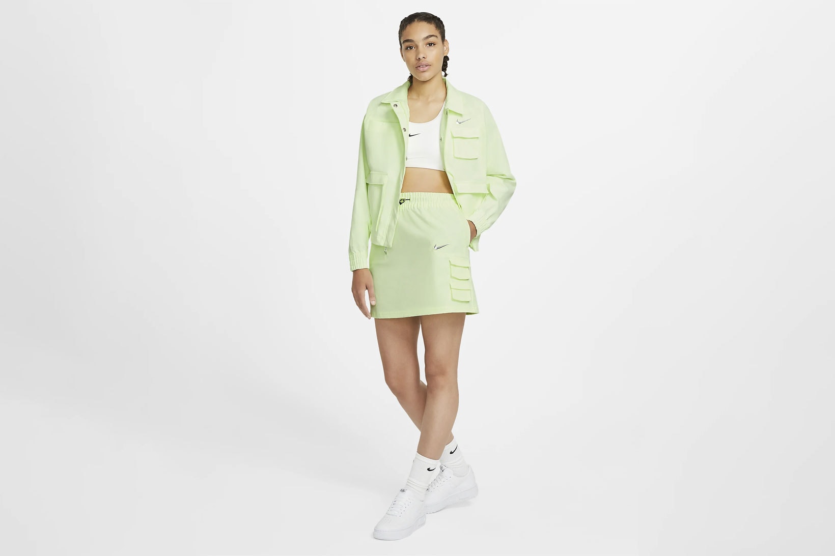 nike sportswear swoosh logo skirt barely volt spring summer outfit green jacket white cropped top sneakers