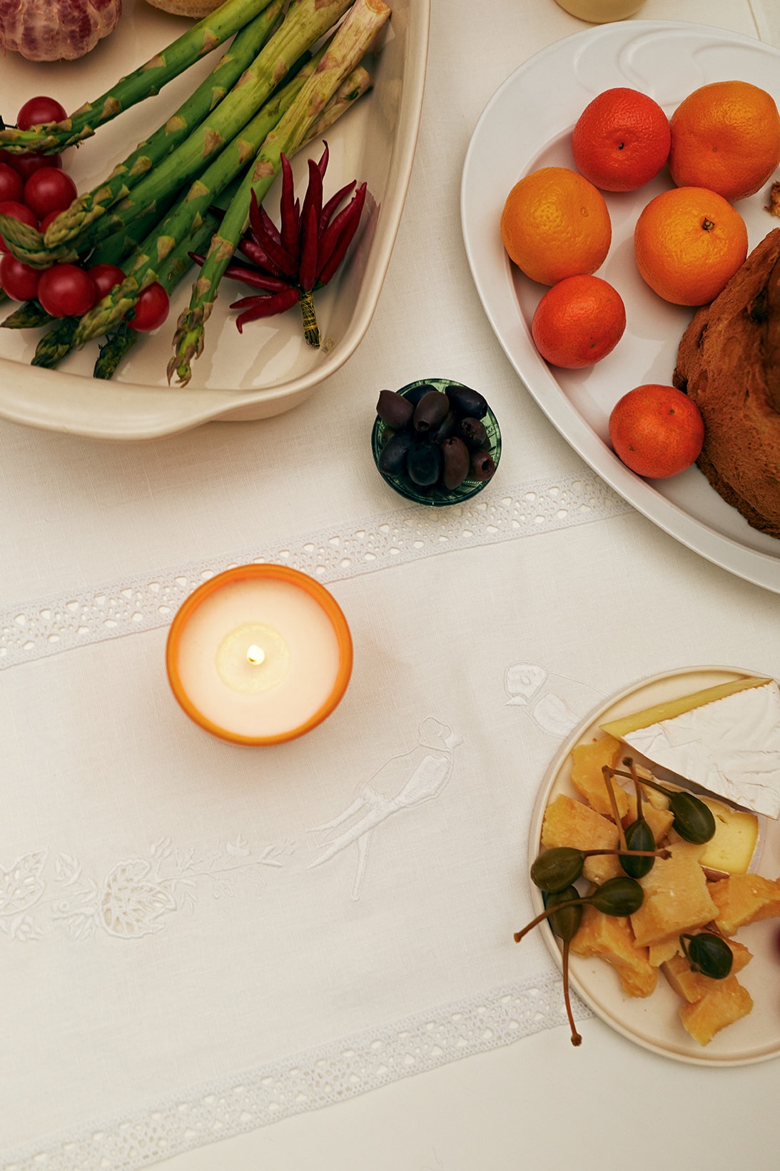 sleeper home homeware decor collection candle plates asparagus food fruits orange table cloth white