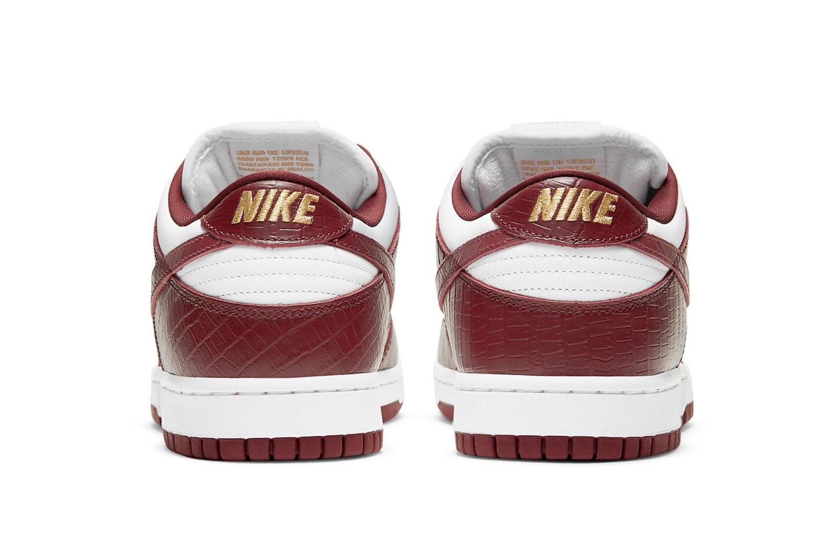 supreme nike sb dunk low collaboration sneakers barkroot brown burgundy red white gold heel