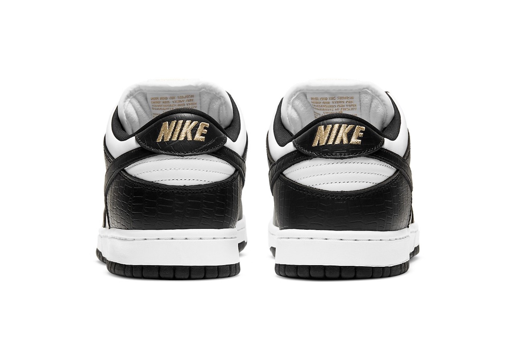 supreme nike sb dunk low collaboration sneakers black white colorway gold heel