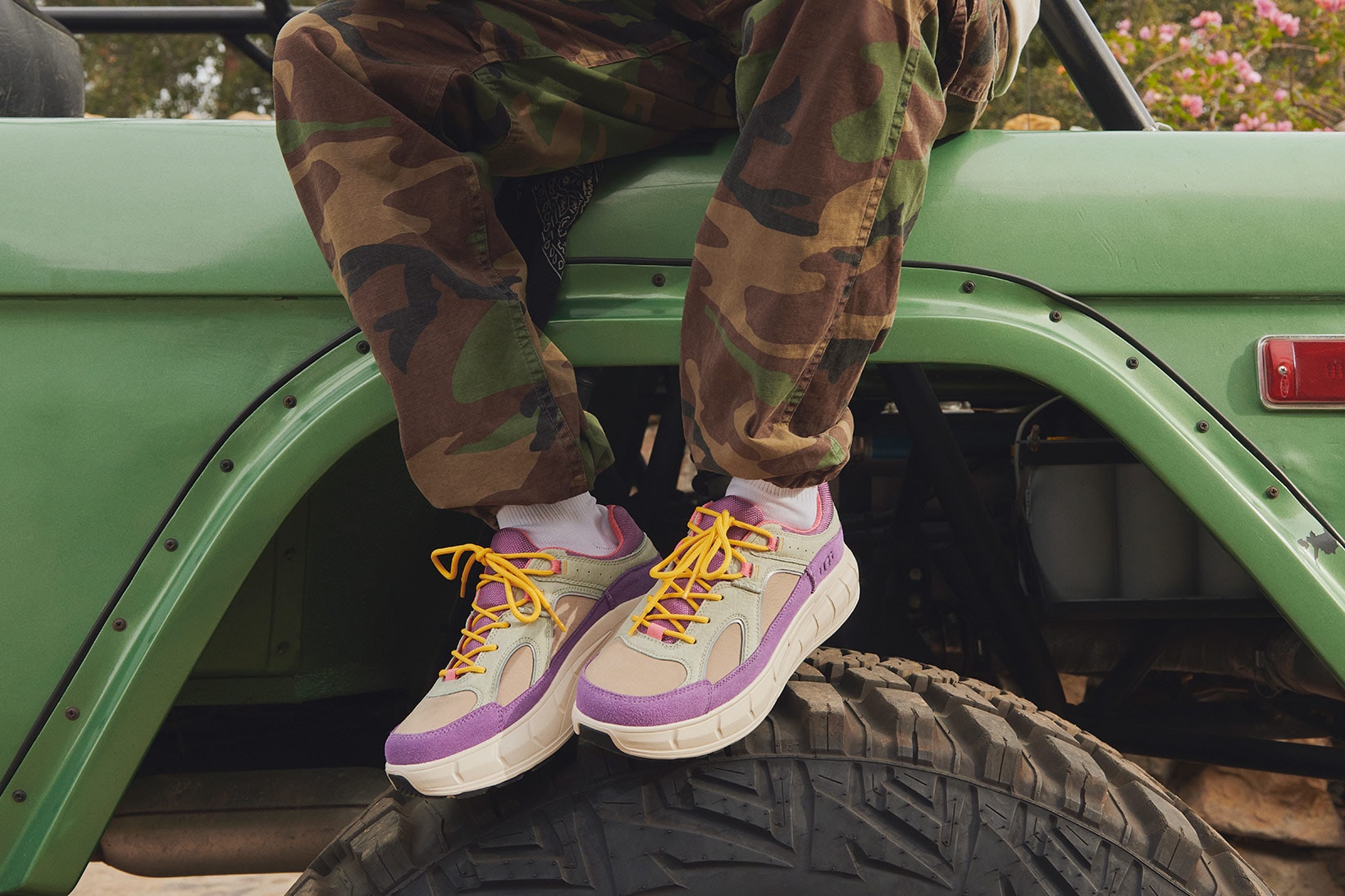ugg spring summer collection campaign sneakers westsider low purple green camo pants