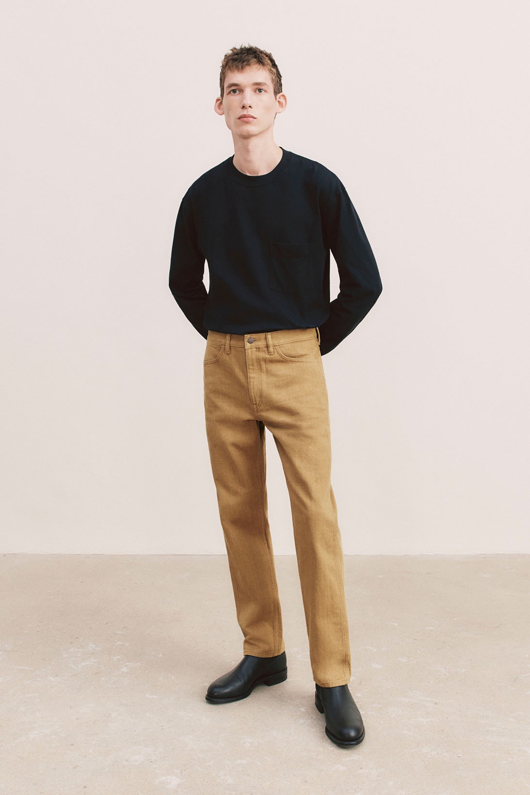 uniqlo u spring summer collection black sweater brown pants shoes