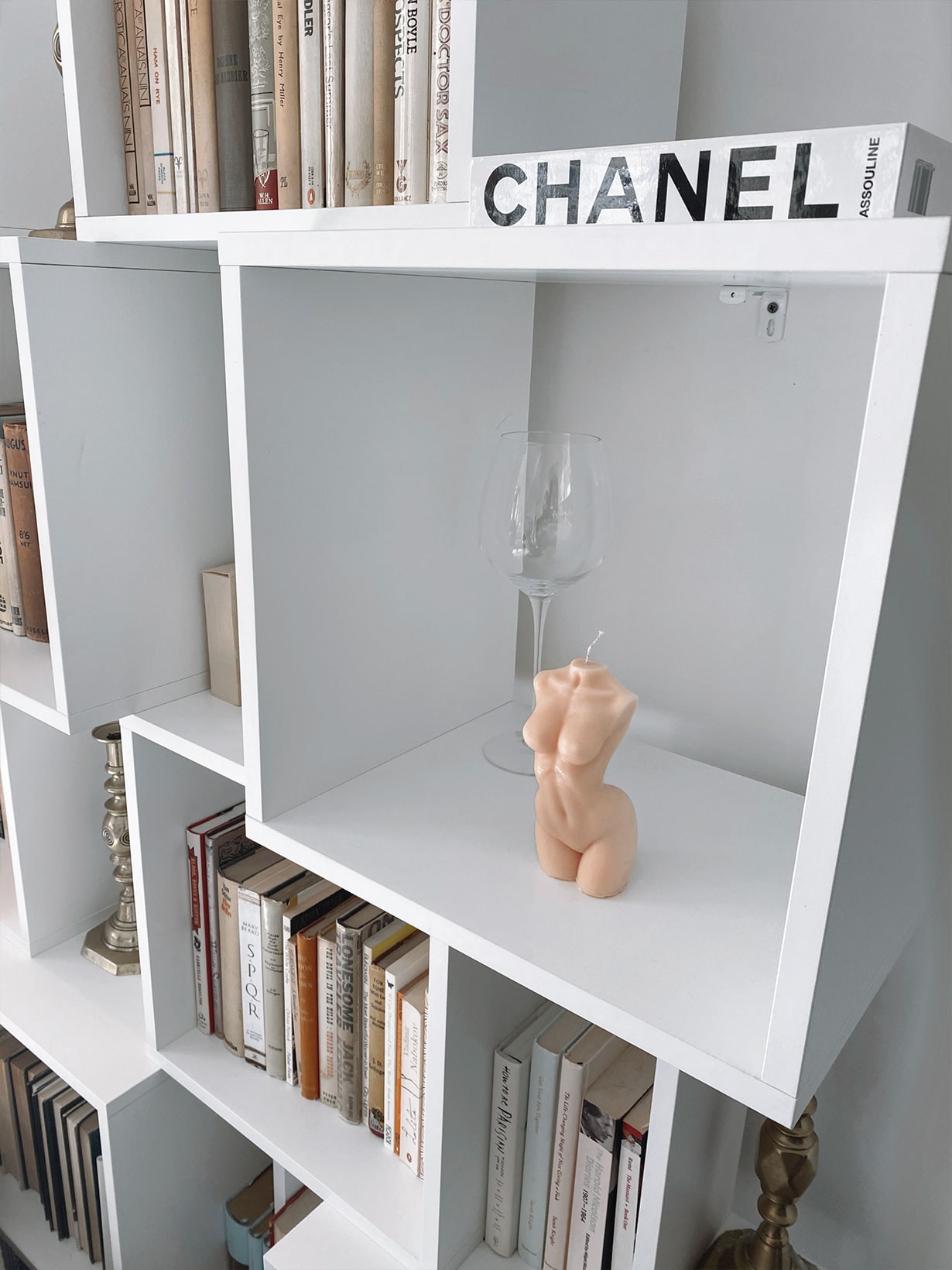 caia nude body torso candles pink home shelf books