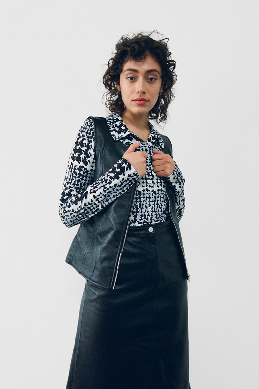 stussy spring 2021 collection lookbook womenswear black and white shirt leather vest skirt