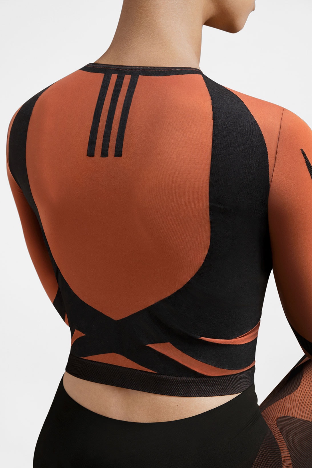 wolford adidas activewear performance collaboration seamless sheer motion crop top long sleeved orange black back details