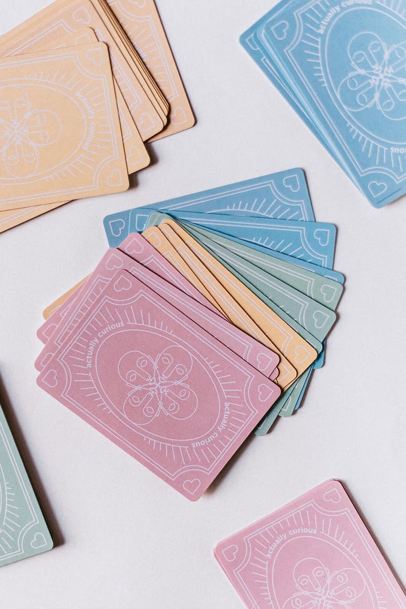 actually curious card game culture happy hour curiosity edition pink orange blue green