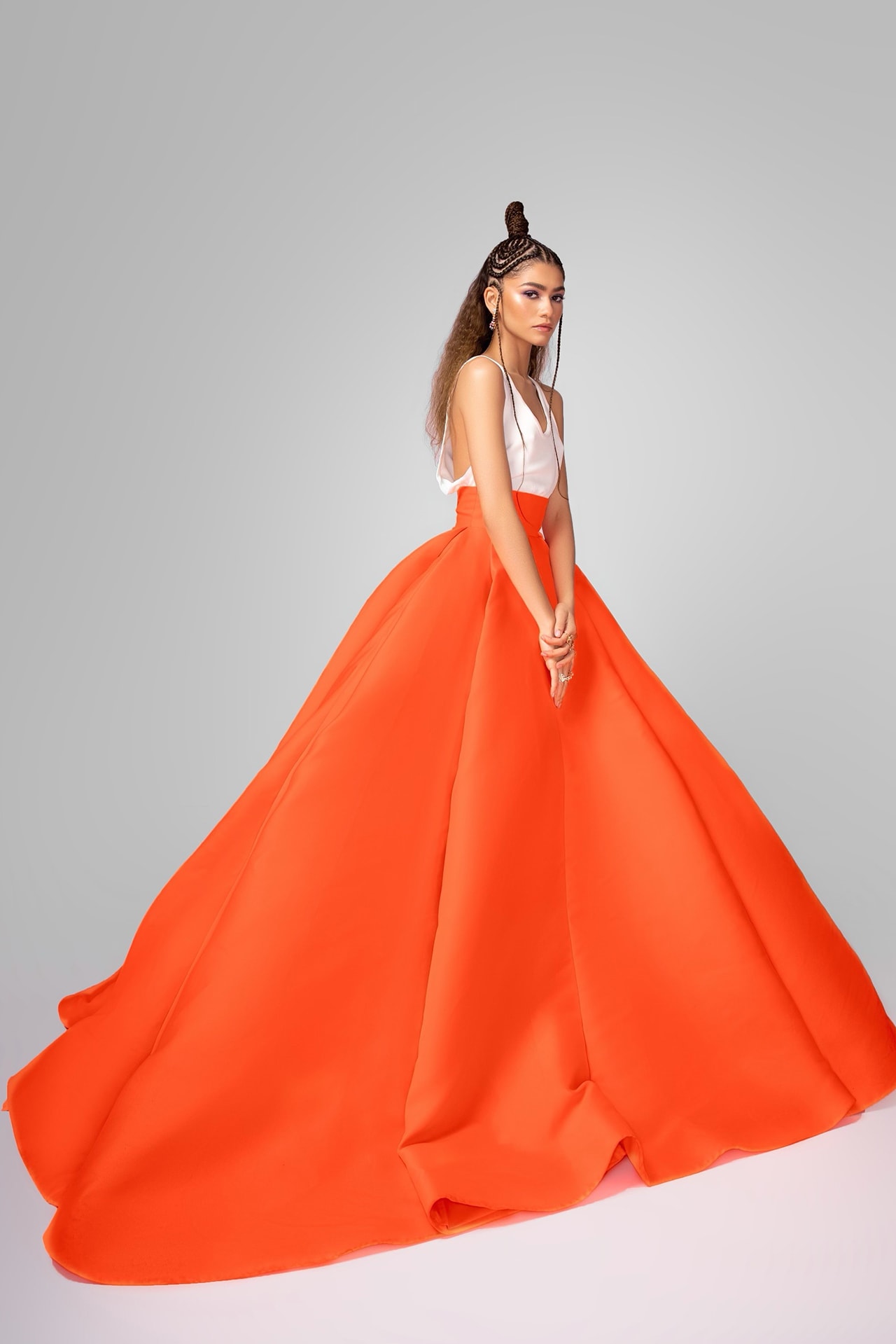 zendaya 2021 critics choice awards red carpet valentino haute couture dress skirt neon orange white hairstyle bulgari jewelry