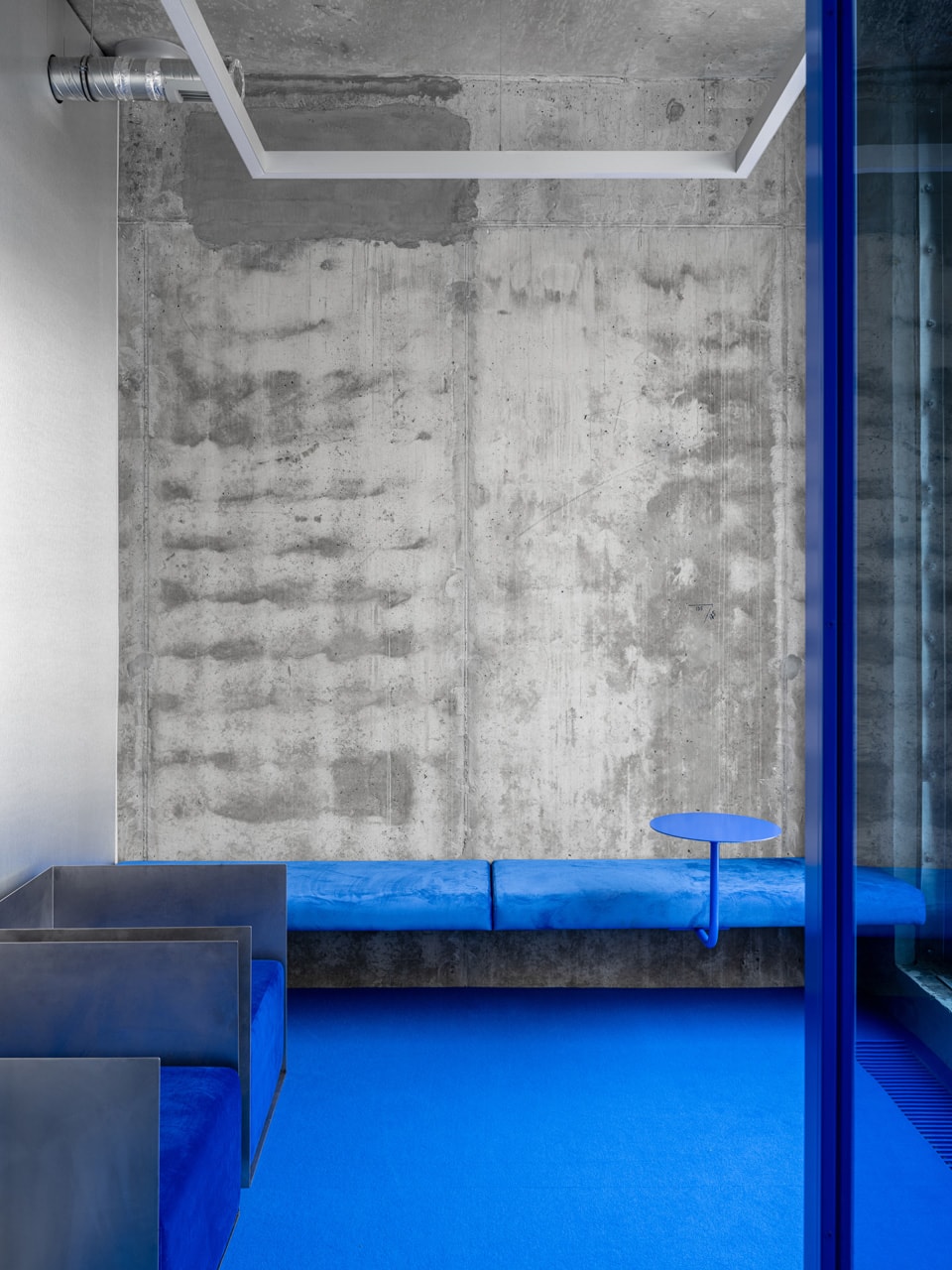 crosby studios moscow flagship store russia opening interior design harry nuriev wall bench blue