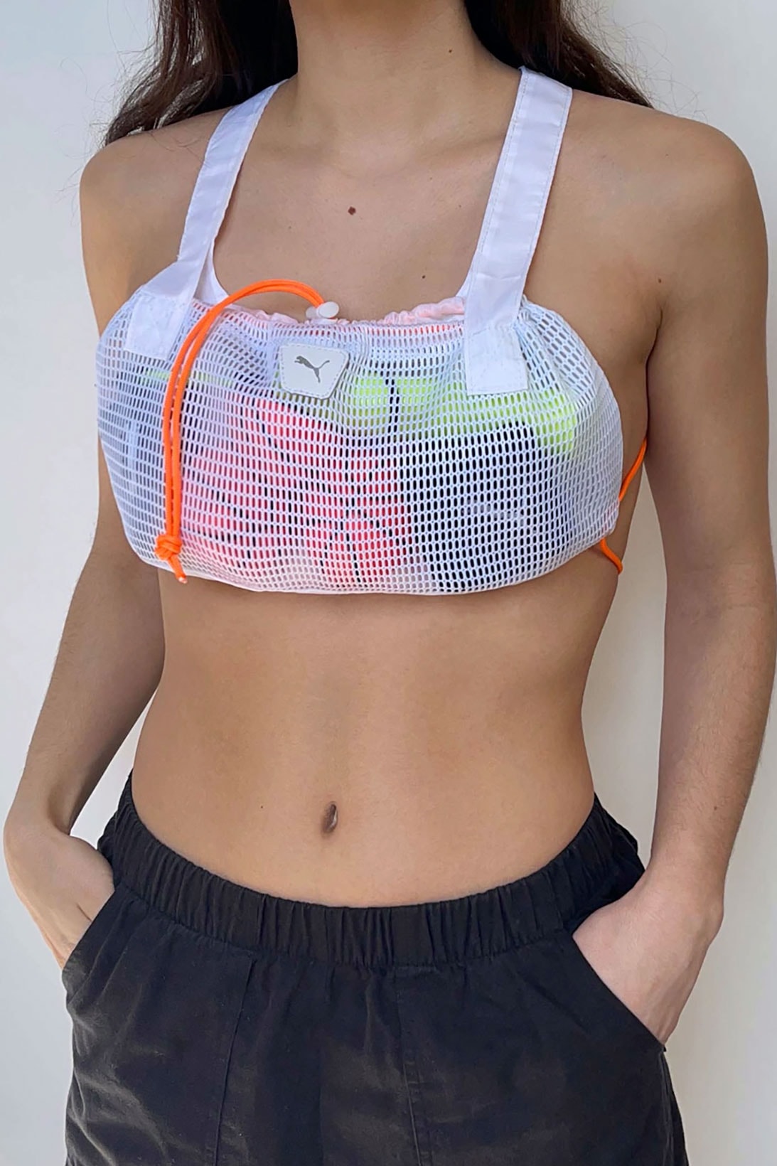 nicole mclaughlin puma upcycled sports bras collaboration women win white