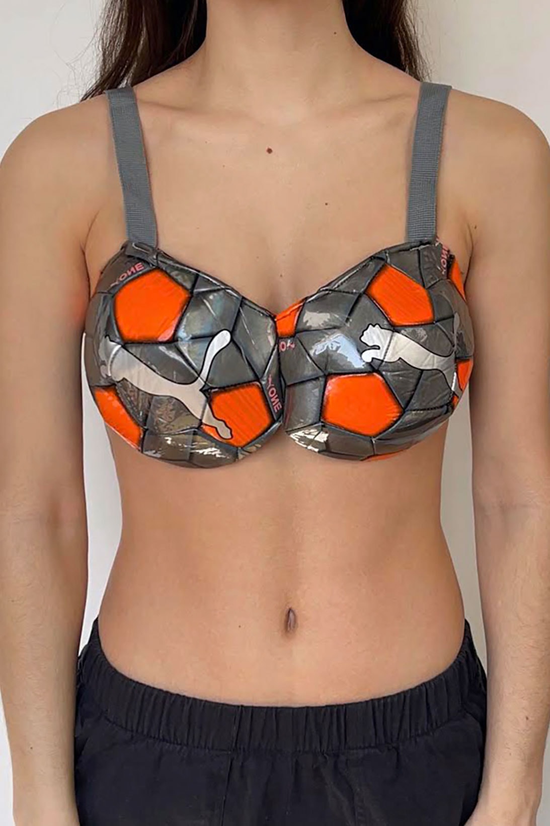 nicole mclaughlin puma upcycled sports bras collaboration women win gray orange