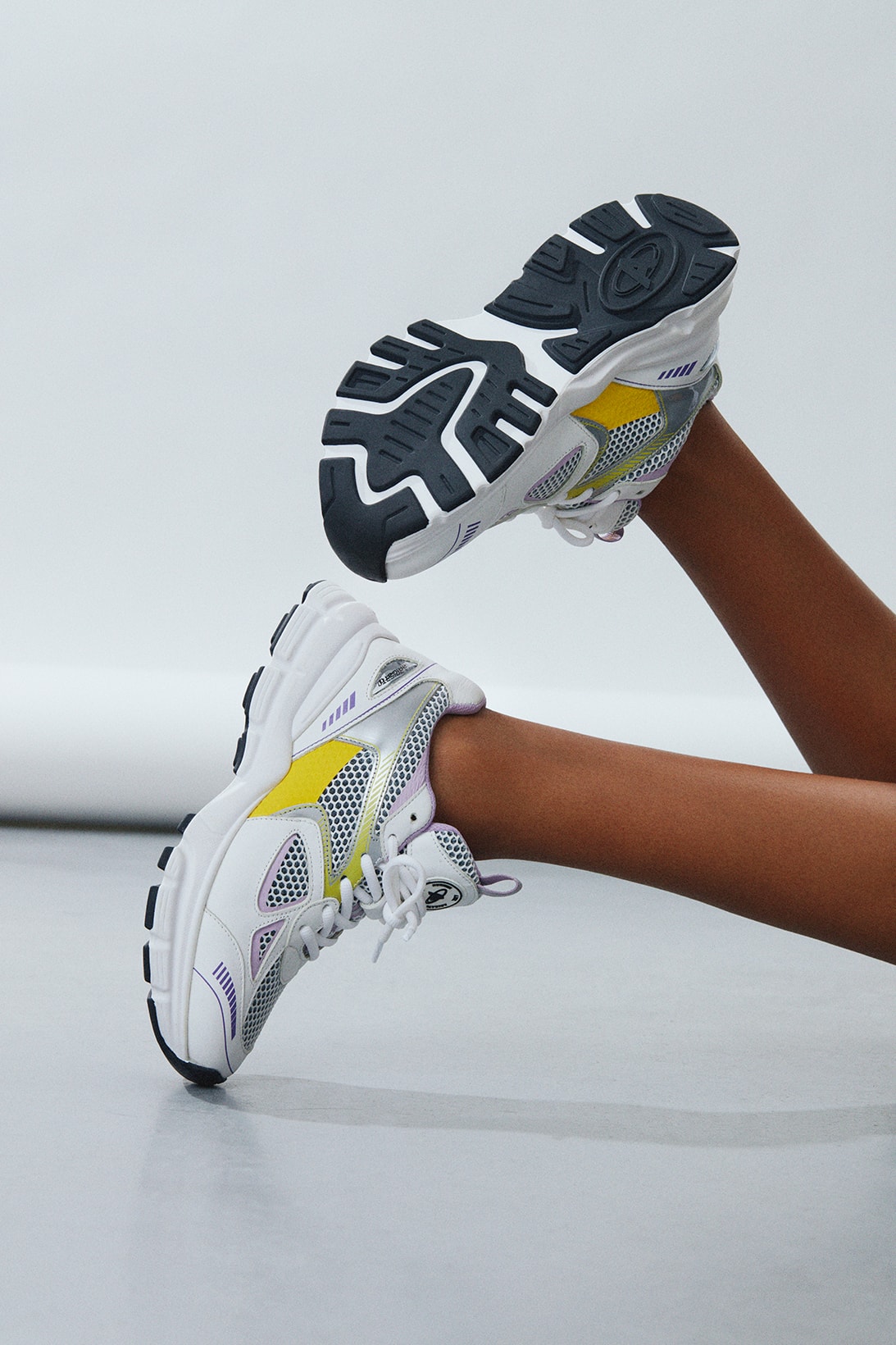 axel arigato marathon runner sneakers white yellow purple gray lateral sole