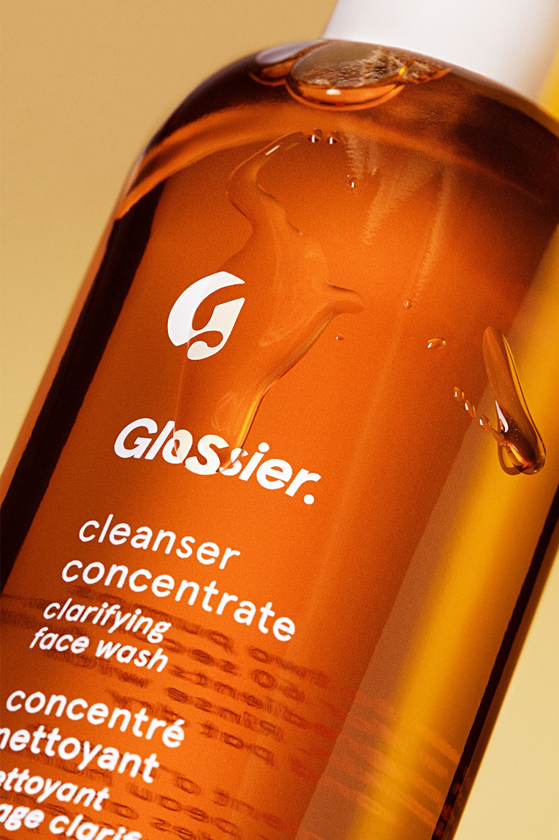 glossier cleanser concentrate face wash bottle packaging label logo