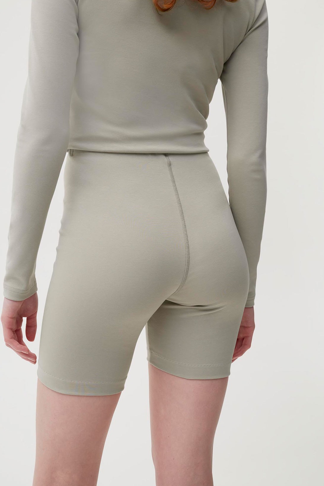 pangaia roica stretch athleisure sustainable collection turtleneck top bike shorts gray beige