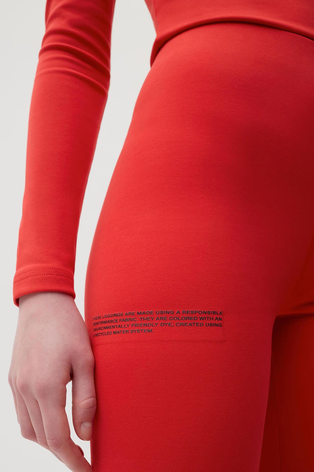 pangaia roica stretch athleisure sustainable collection turtleneck top leggings red