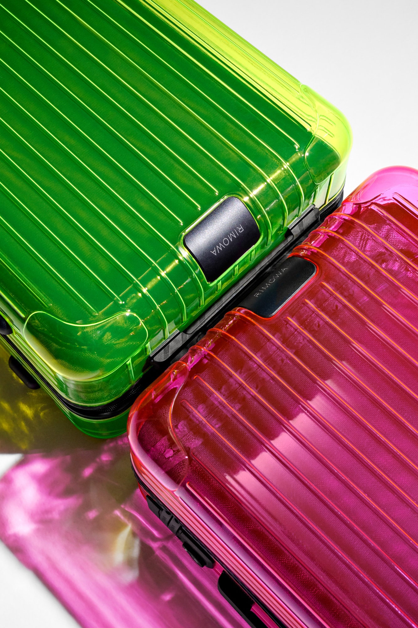 RIMOWA Releases New Neon Suitcase Range Pink Lime Transparent Travel Bags