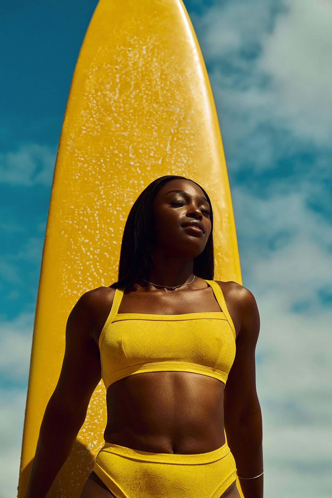 solid and striped sloane stephens tennis player yellow bikini surfboard sky