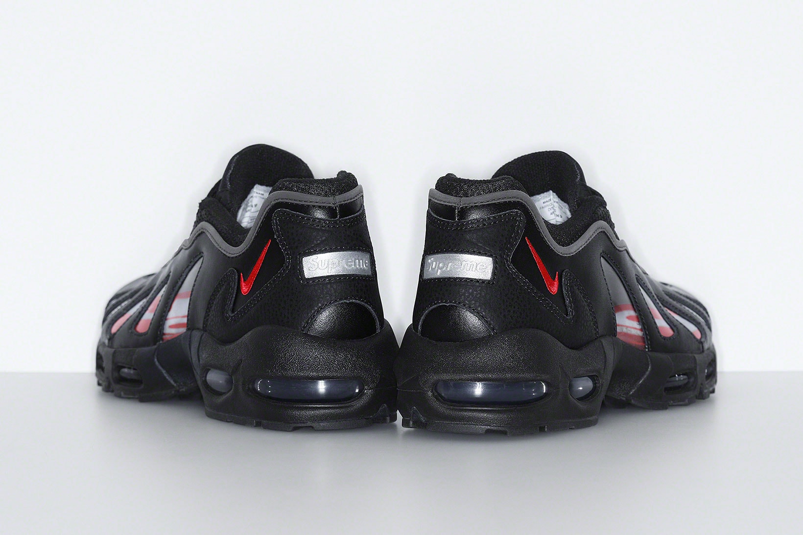supreme nike air max am96 sneakers collaboration black heel back