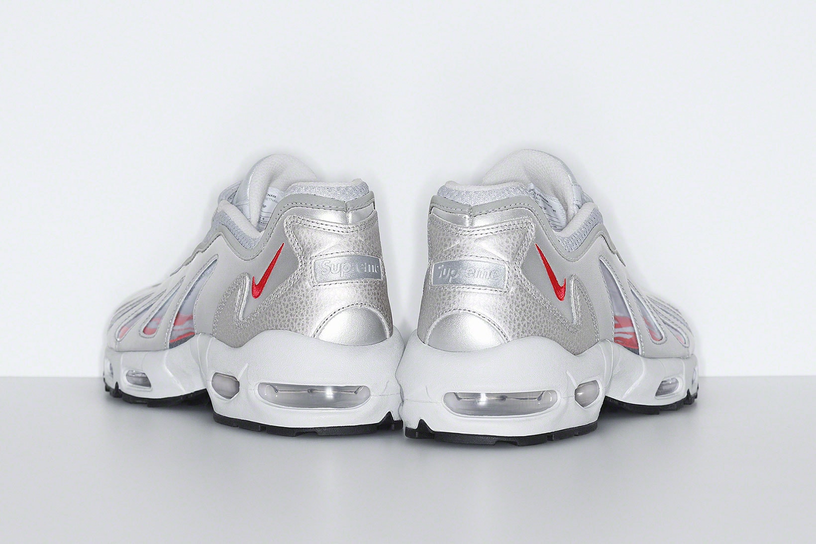 supreme nike air max am96 sneakers collaboration silver white back heel