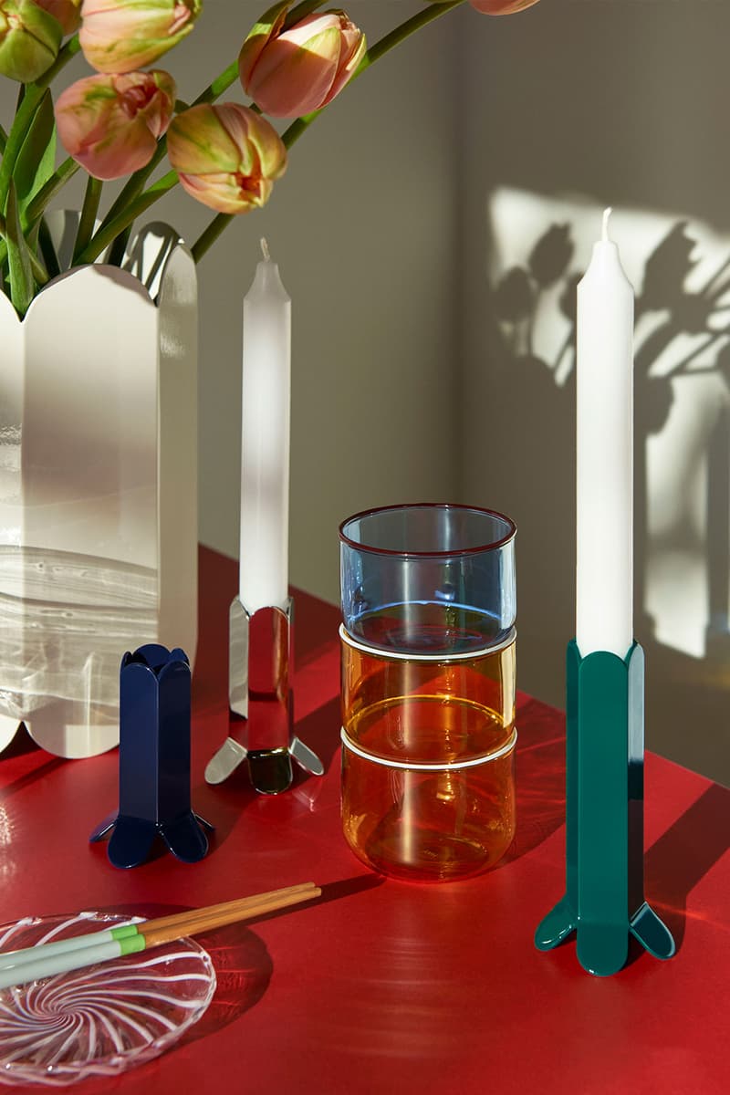 HAY green candle holder on red table with plate and chopsticks