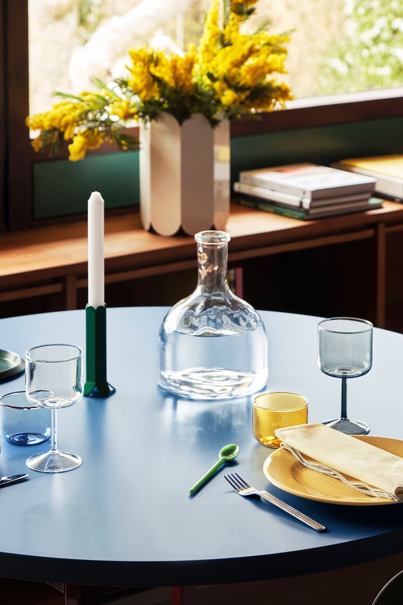 HAY dark blue table with yellow plate and green candle holder