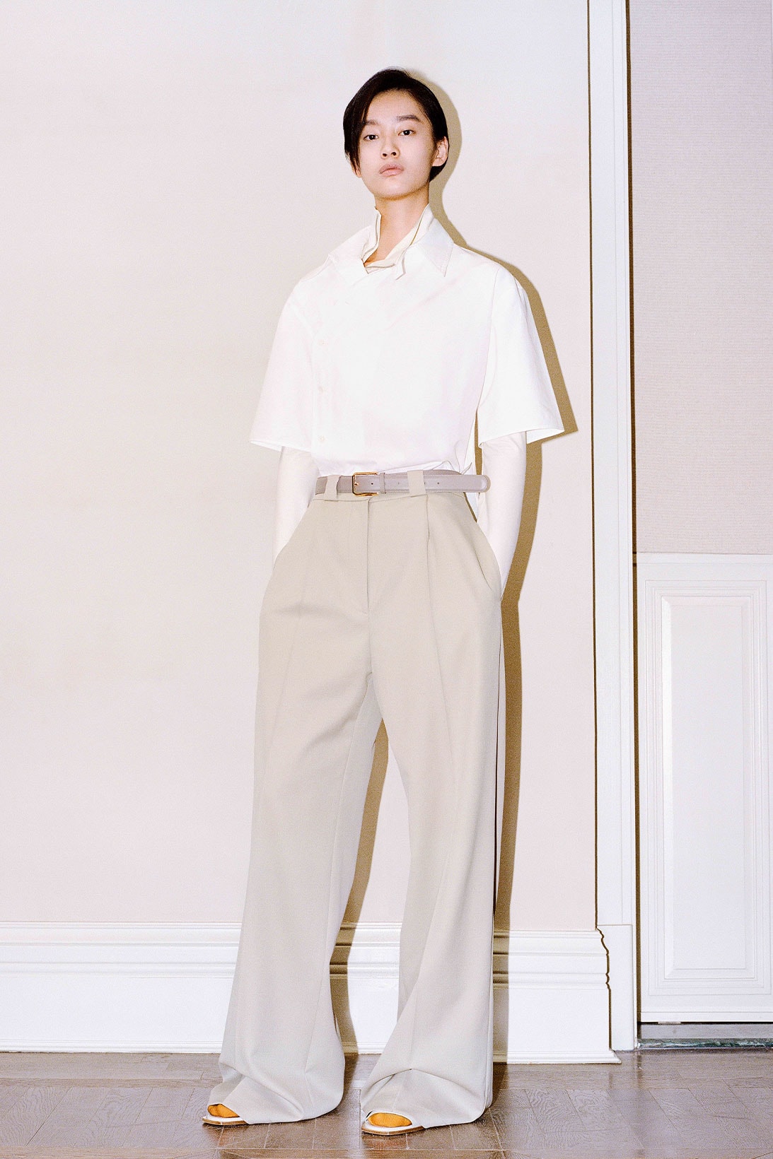 Shanghai Tang Yuni Ahn model white button up shirt beige pants