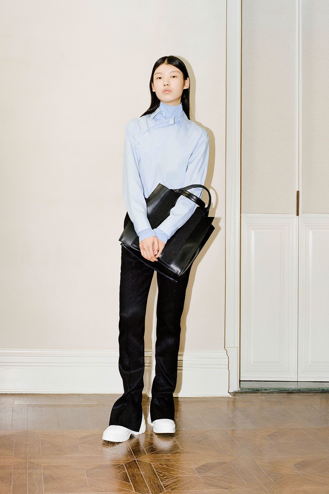 Shanghai Tang Yuni Ahn model blue long sleeve top black pants