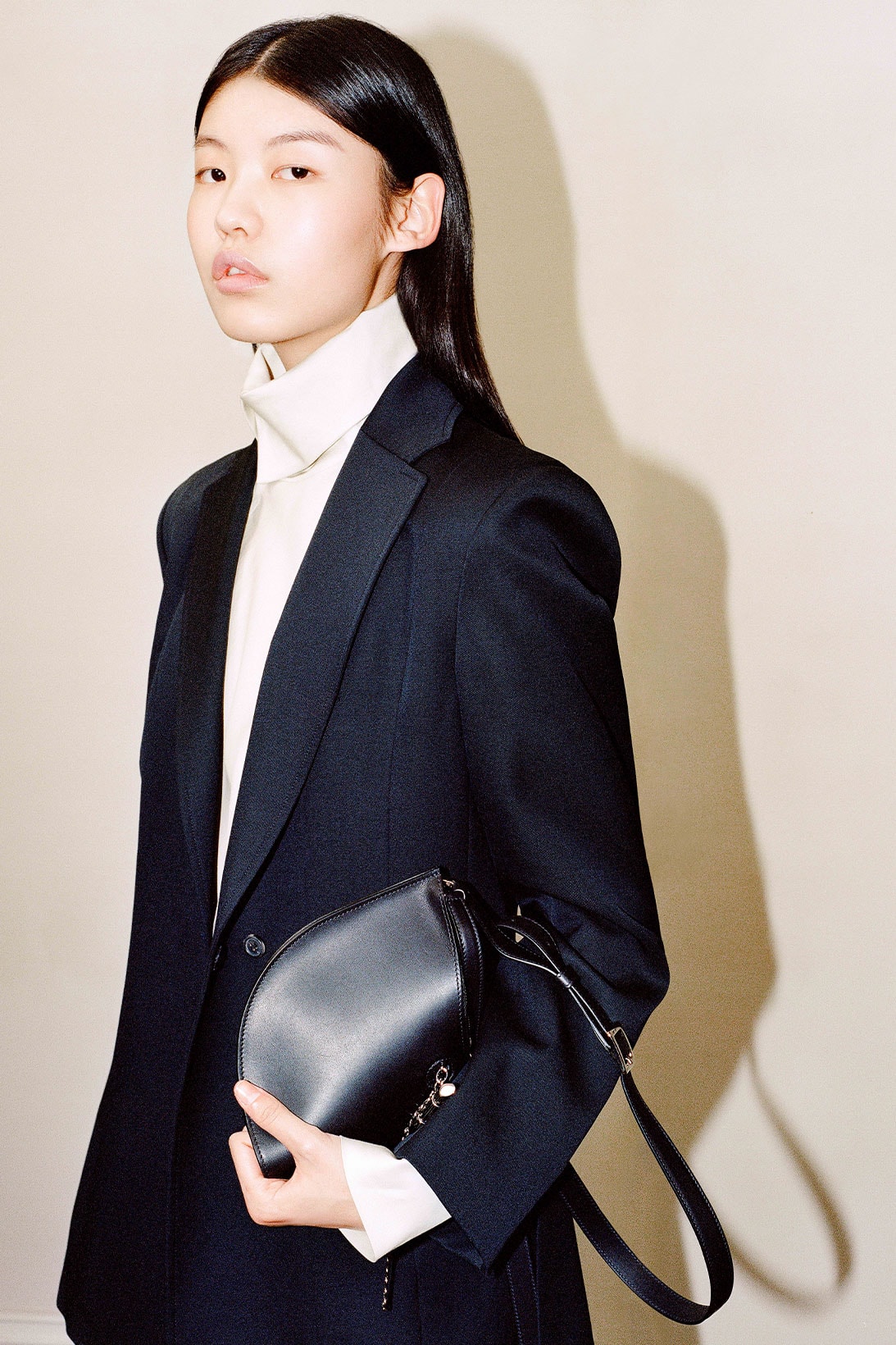Shanghai Tang Yuni Ahn model black fortune cookie bag