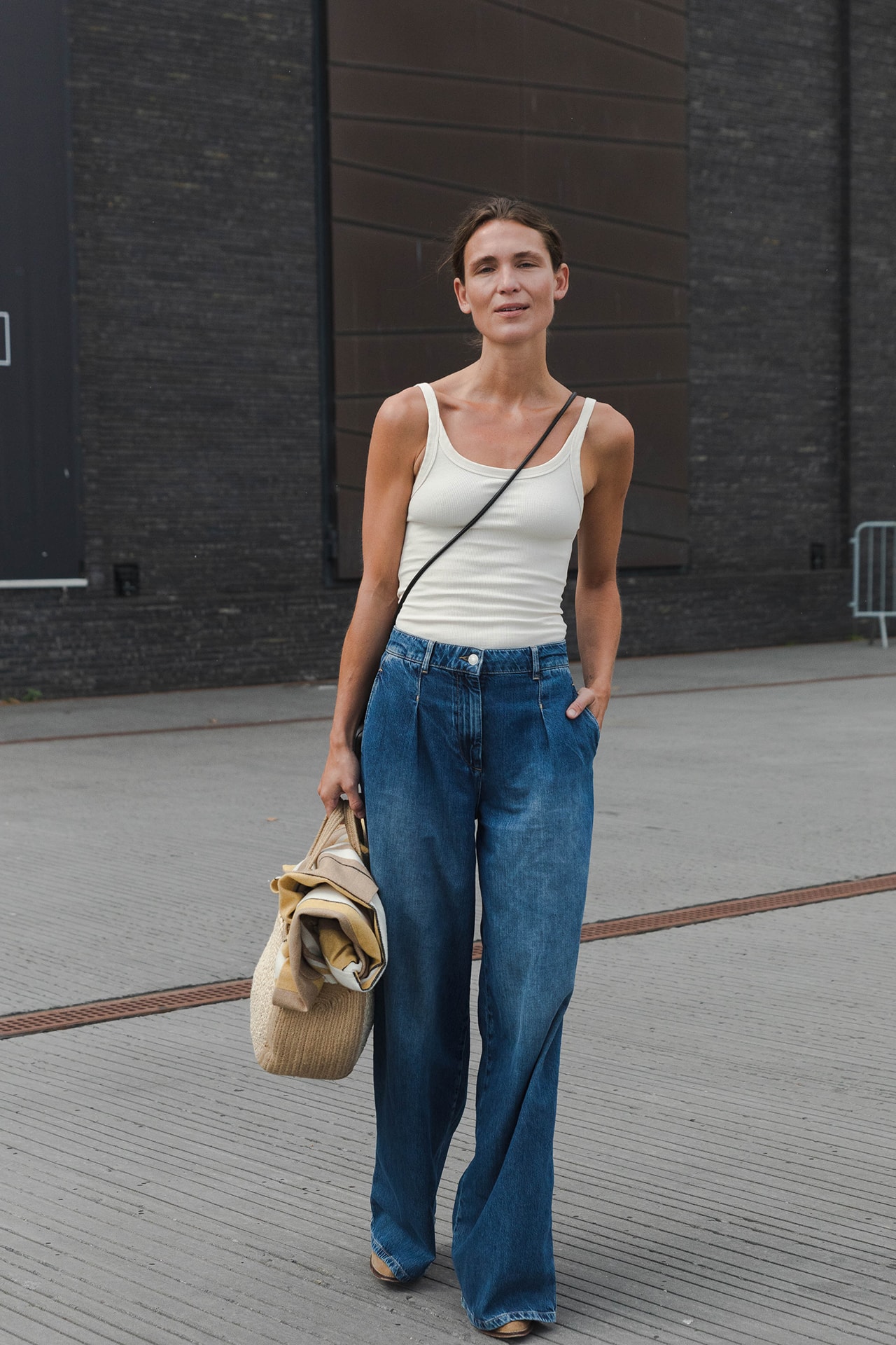 Street Style Copenhagen Fashion Week SS22 Spring Summer 2022 White Tank Top Jeans