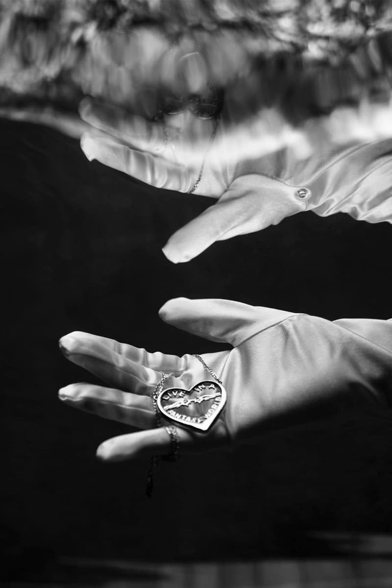 Twelve Jewelry Necklaces Under Water on Hand