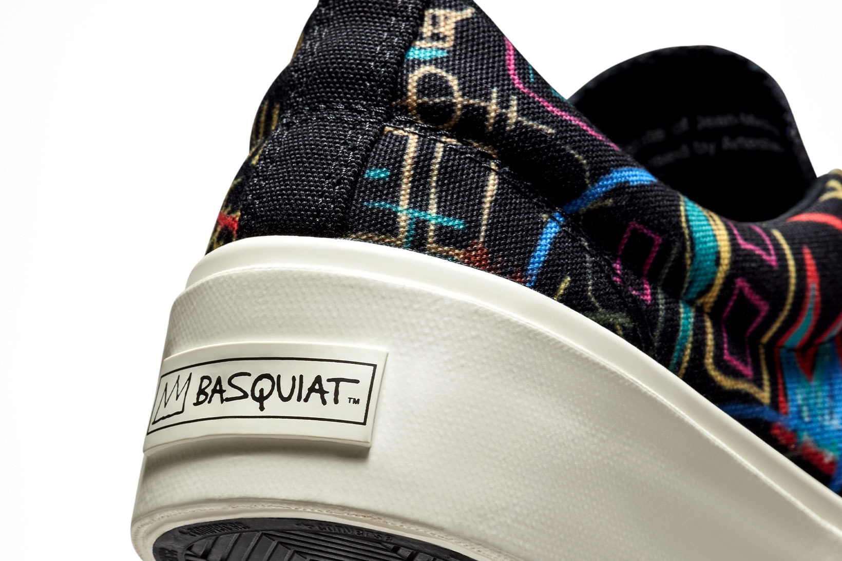 converse x basquiat skidgrip heel close up shot white logo