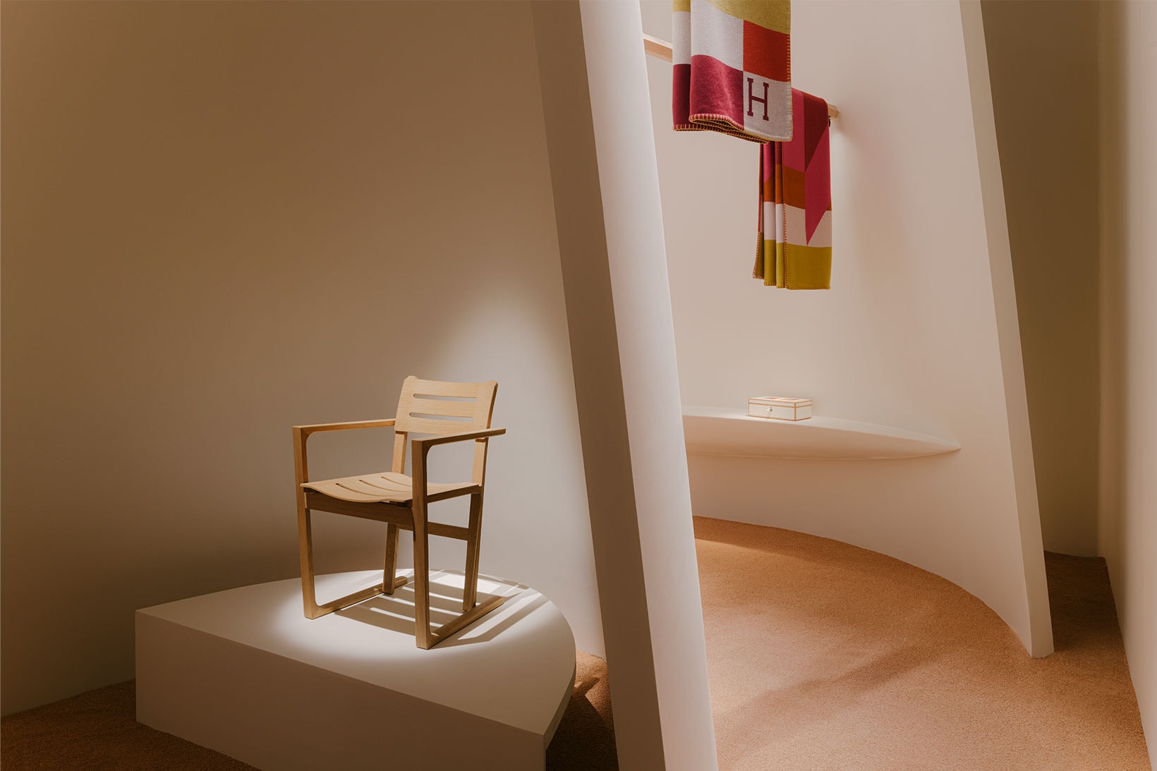Hermés "Collection for the Home 2021-2022" wooden chair and plaids