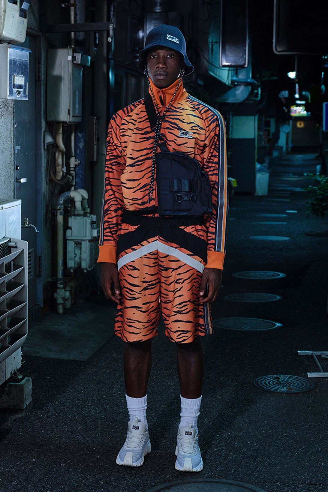 onitsuka tiger ss22 collection milan tokyo orange tiger print jacket shorts belt bag bucket hat